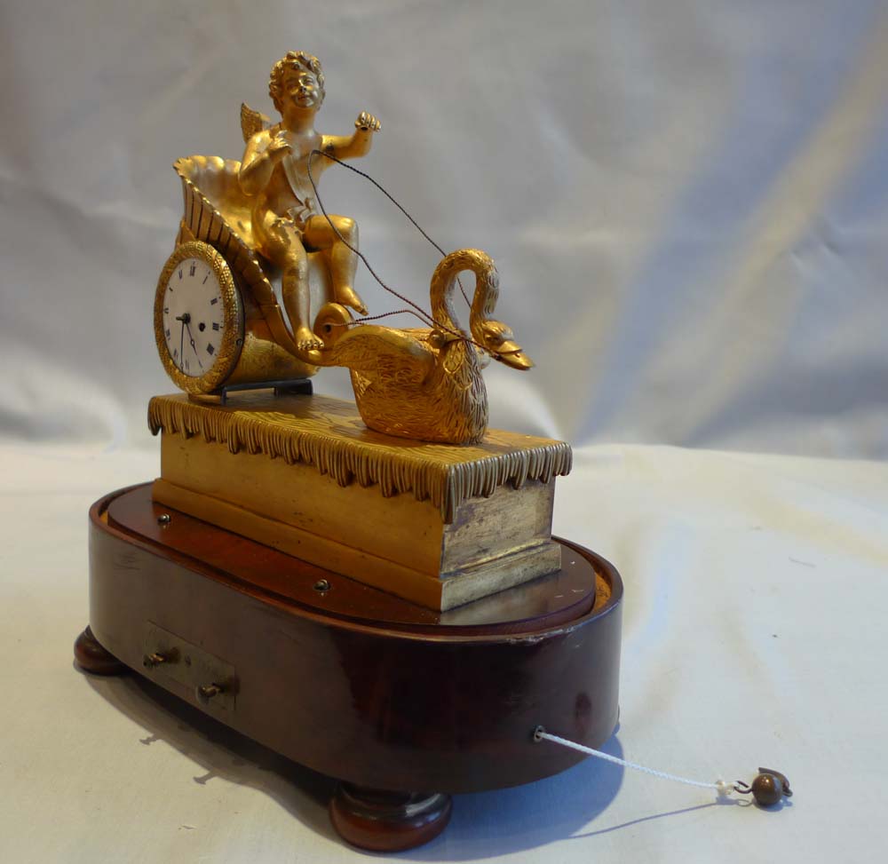 French Empire miniature ormolu clock with two tune musical base.