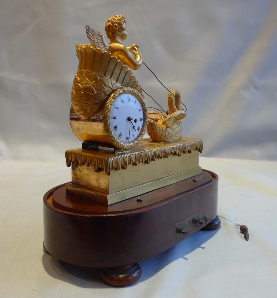 French Empire miniature ormolu clock with two tune musical base.