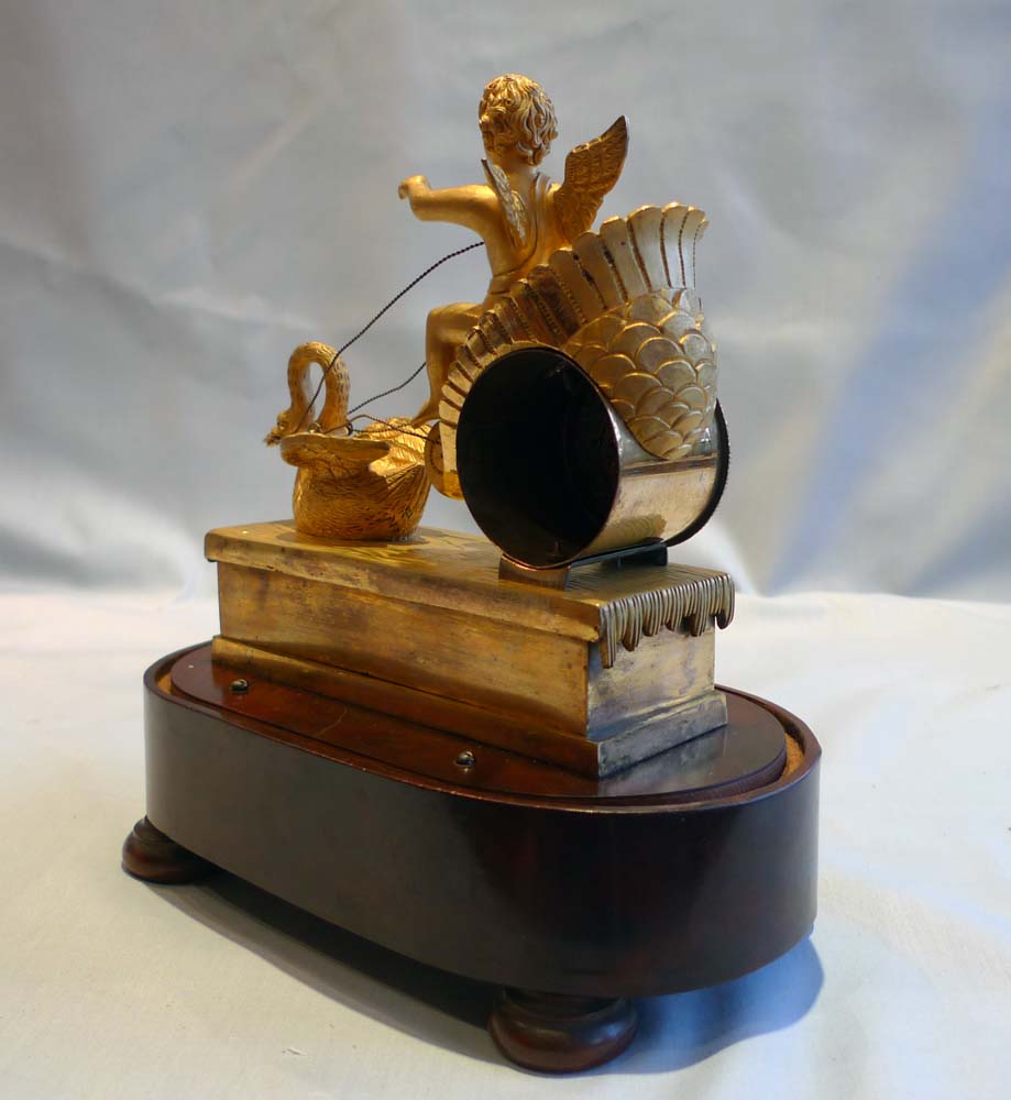 French Empire miniature ormolu clock with two tune musical base.