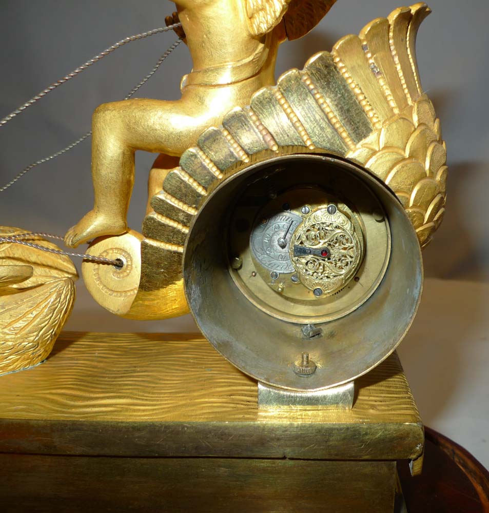 French Empire miniature ormolu clock with two tune musical base.