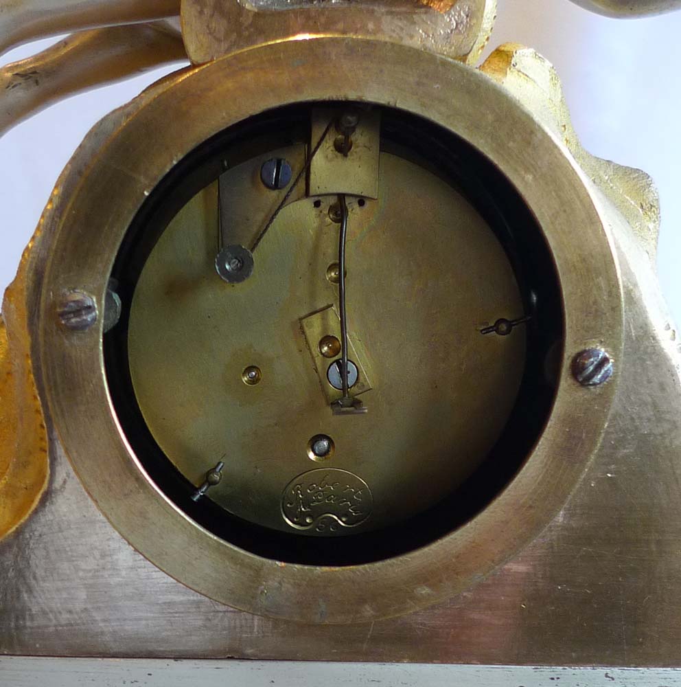 Charles X silvered bronze and ormolu miniature mantel clock on musical base.