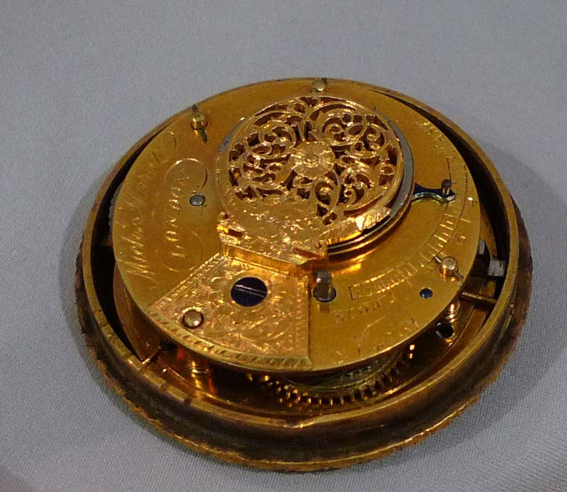 French Empire antique miniature musical mantel clock of dog pulling a chariot.