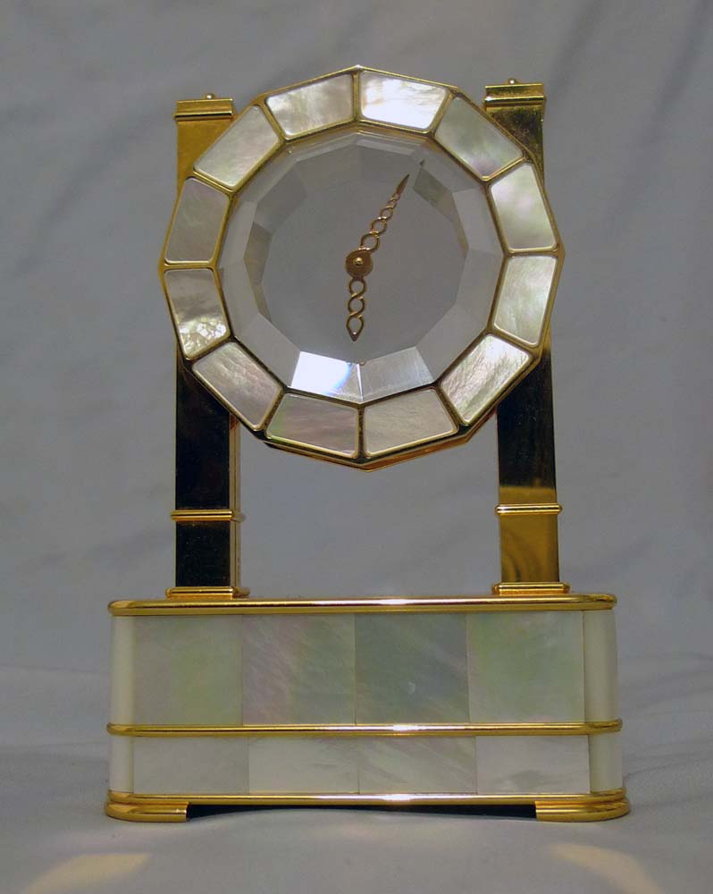 Mystery clock in silver gilt, mother of pearl and rock crystal by Imhof