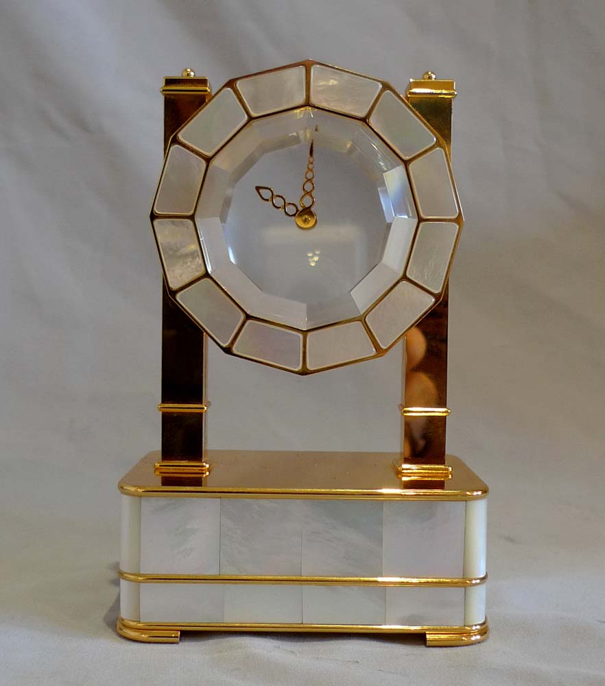 Mystery clock in silver gilt, mother of pearl and rock crystal by Imhof