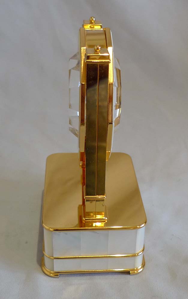 Mystery clock in silver gilt, mother of pearl and rock crystal by Imhof