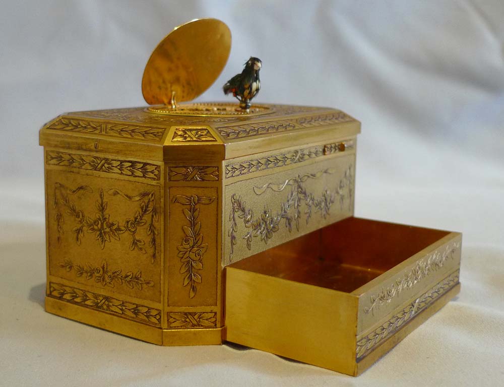 Antique singing bird box finely engraved with mechanically opening drawer, Bontems France.