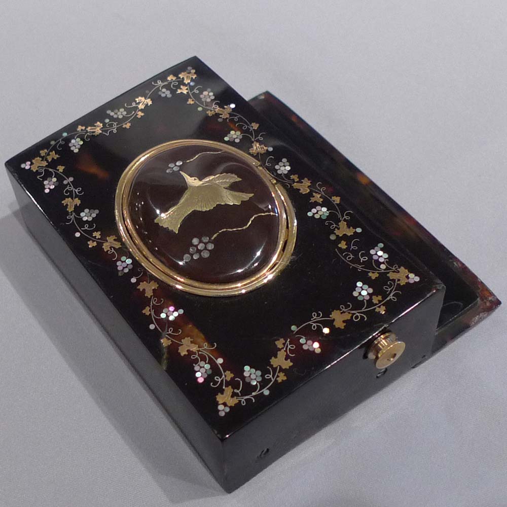 Antique singing bird box tortoiseshell and pique work in gold and shell.