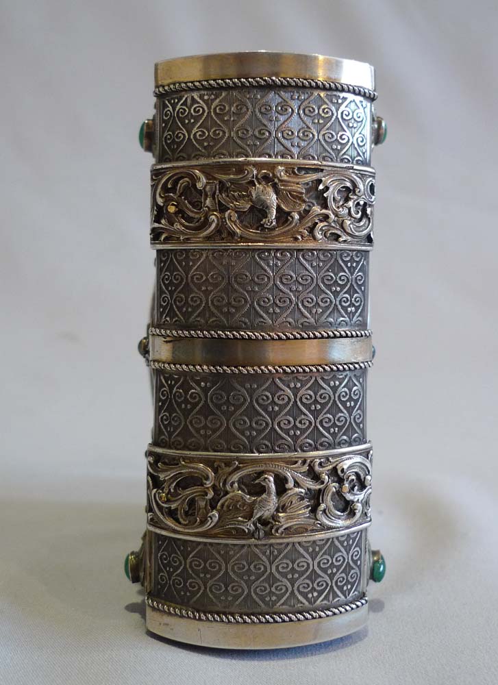 Singing bird box in form of a jewelled book in silver with enamel hand painting.