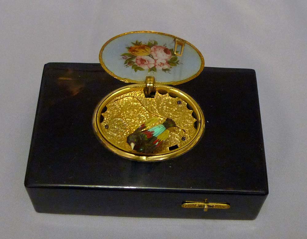Antique singing bird box by Rochat in tortoiseshell , enamel and silver gilt.