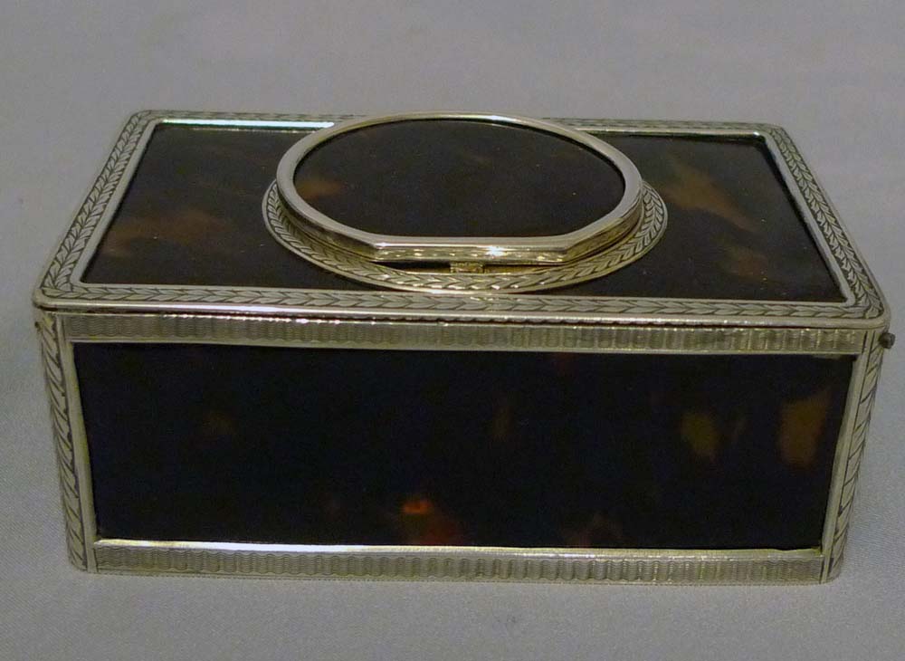 Singing bird box silver with tortoiseshell panels and lid.