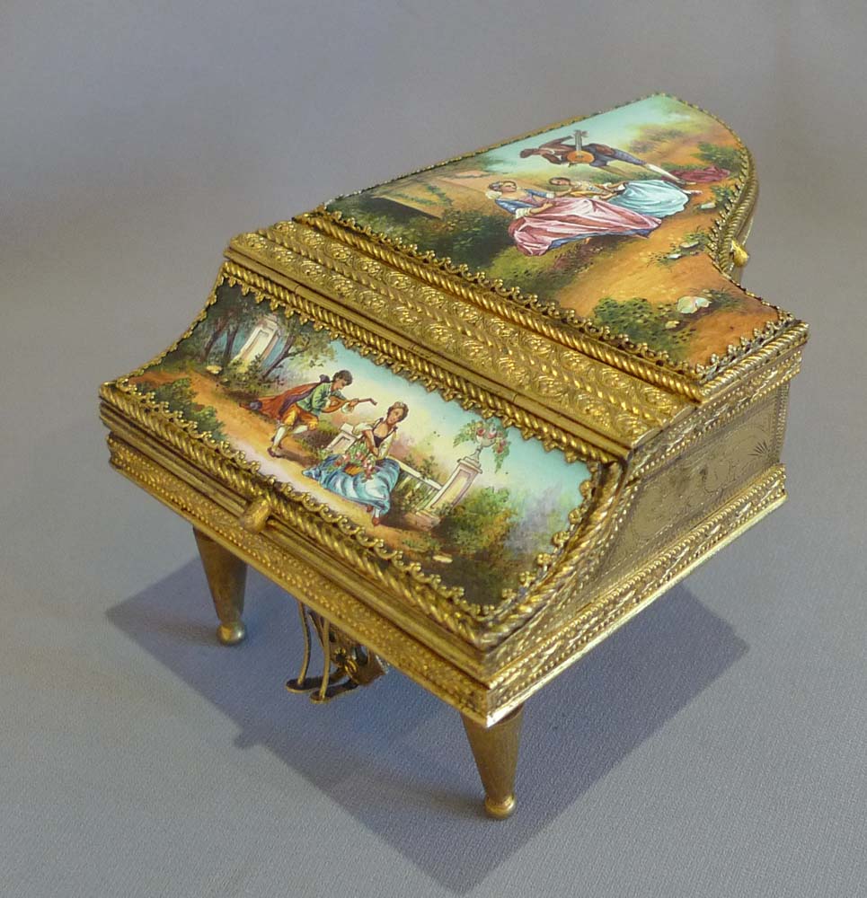 Antique musical grand piano in hand painted enamel and fine gilt bronze.