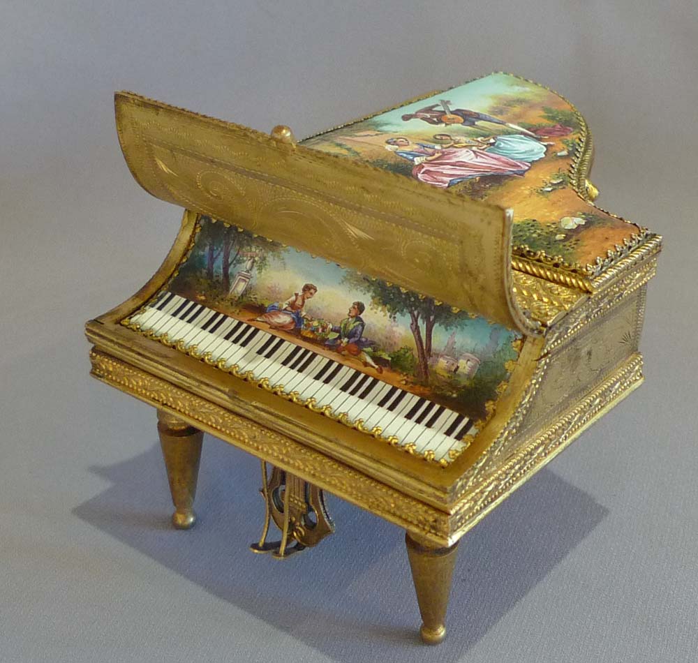 Antique musical grand piano in hand painted enamel and fine gilt bronze.