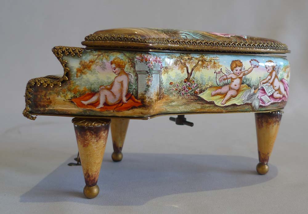 Musical piano in gilt bronze and hand painted enamel.