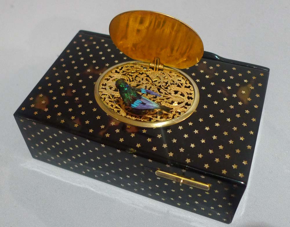 Antique Bontems gold star inlaid tortoiseshell singing bird box in original case.