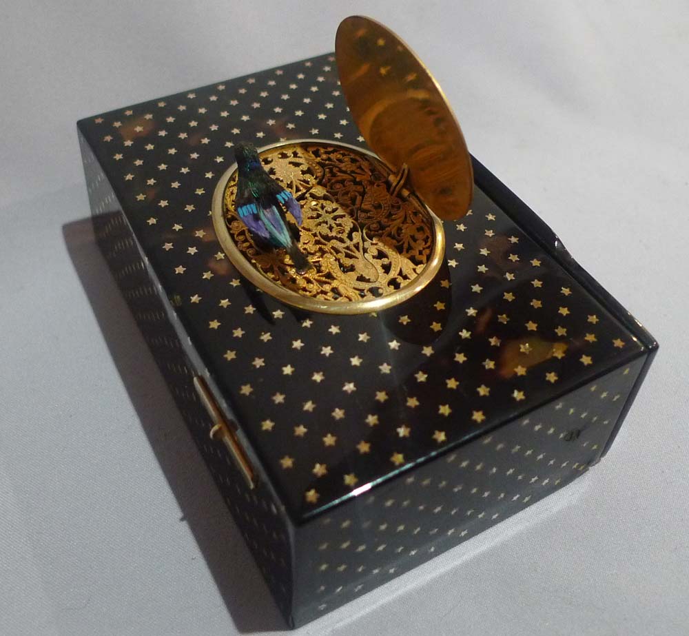 Antique Bontems gold star inlaid tortoiseshell singing bird box in original case.