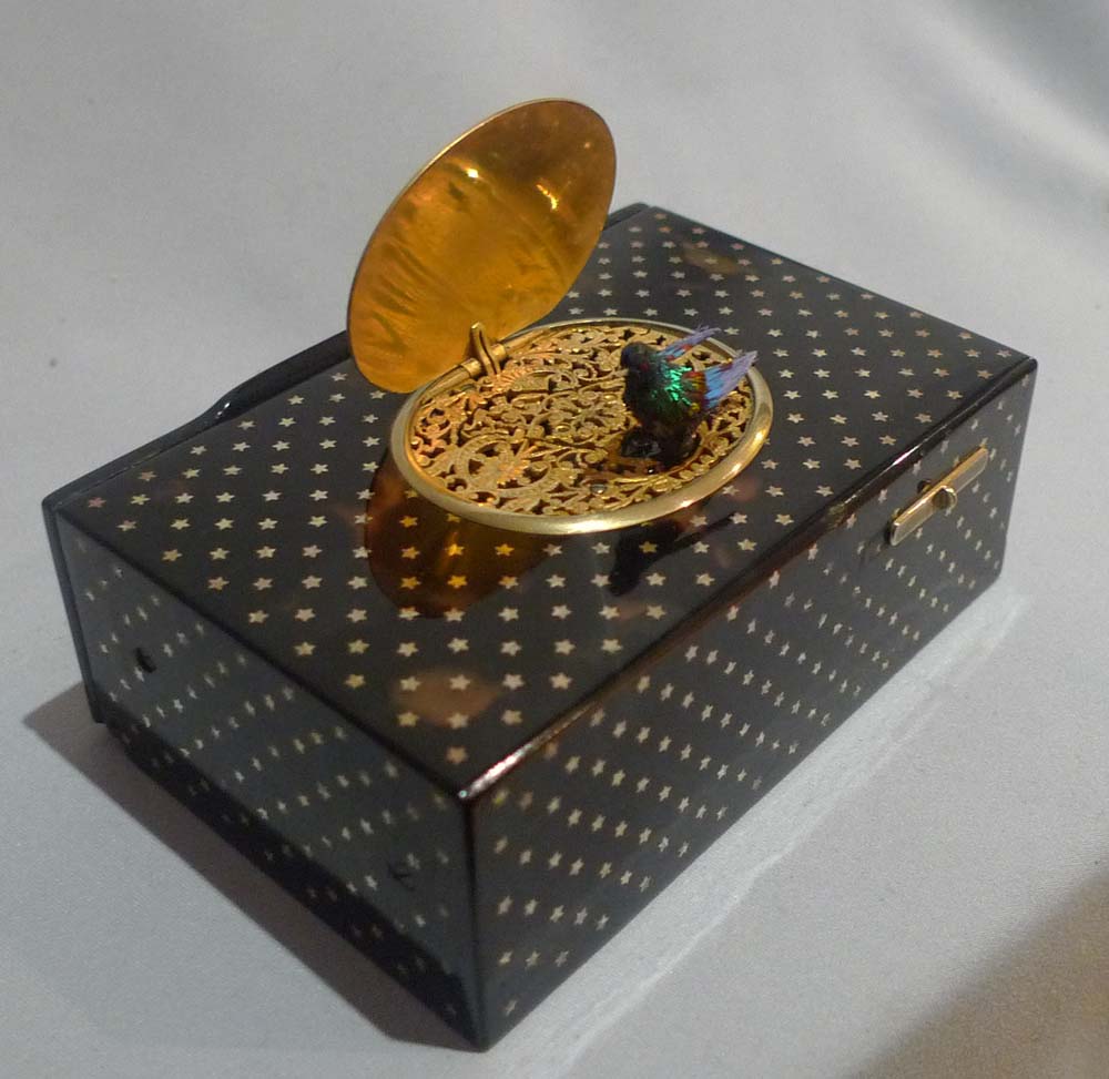 Antique Bontems gold star inlaid tortoiseshell singing bird box in original case.