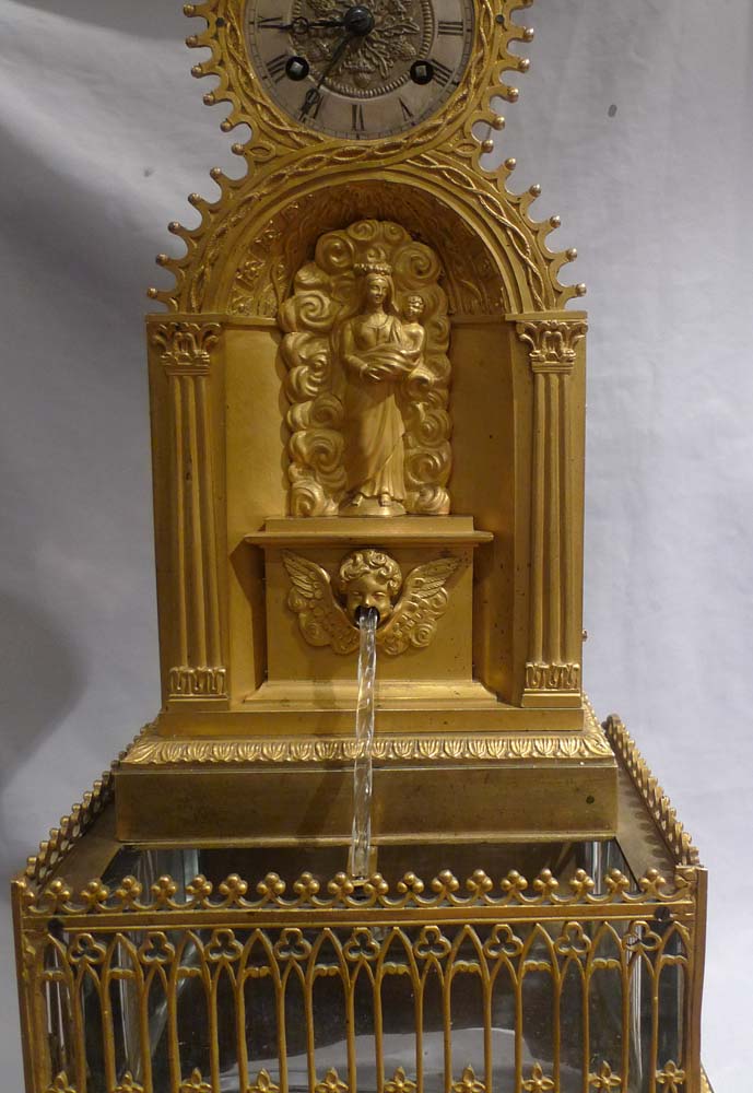 Antique automaton ormolu Gothic revival water clock in form of a fountain.