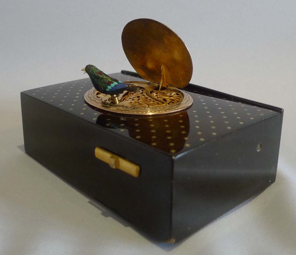 Antique singing bird box by Bontems in tortoiseshell and silver gilt with original case and key.