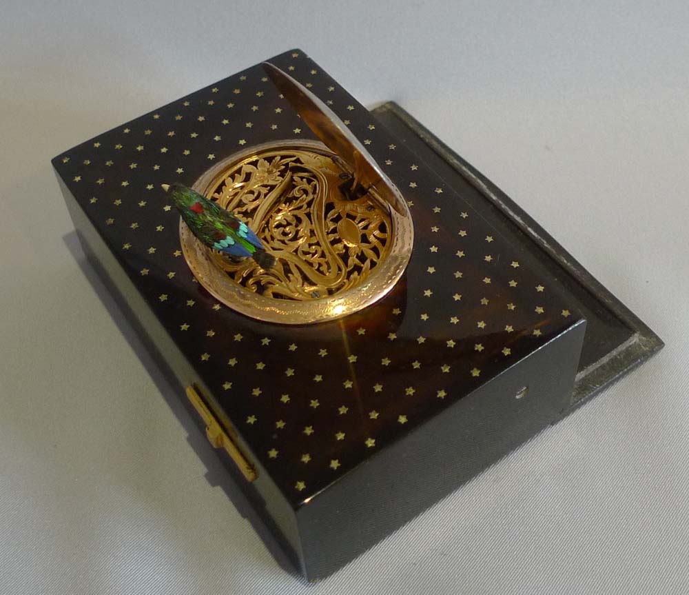 Antique singing bird box by Bontems in tortoiseshell and silver gilt with original case and key.