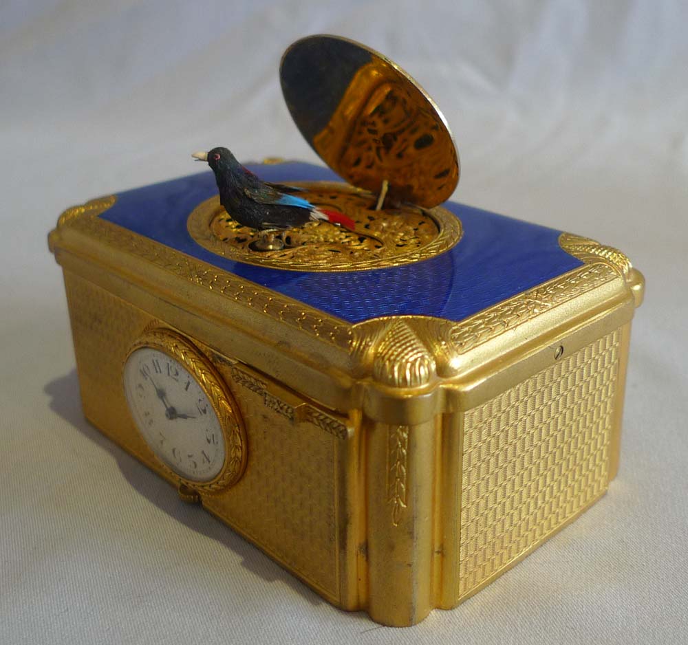 Singing bird box with watch inset in guilloche enamel and gilt bronze in original case.