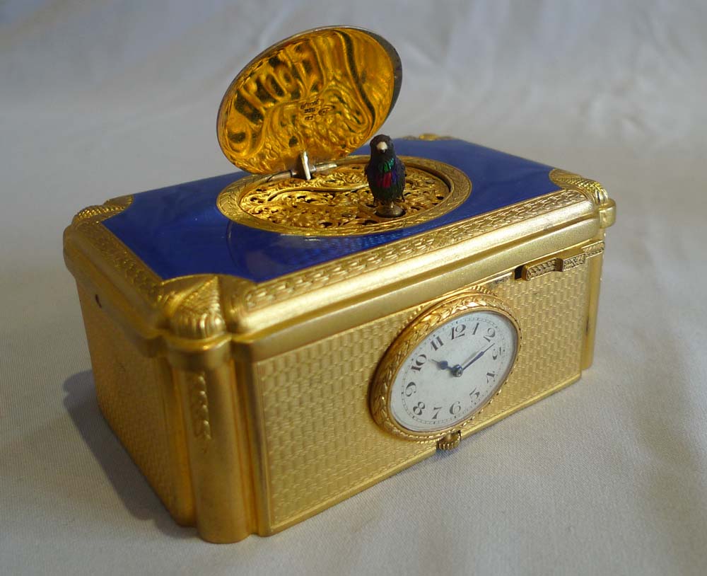 Singing bird box with watch inset in guilloche enamel and gilt bronze in original case.