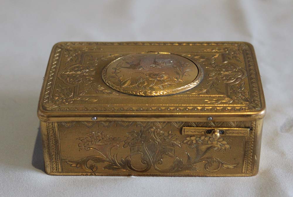 Singing bird box all over engraved gilt bronze case OMM movement.
