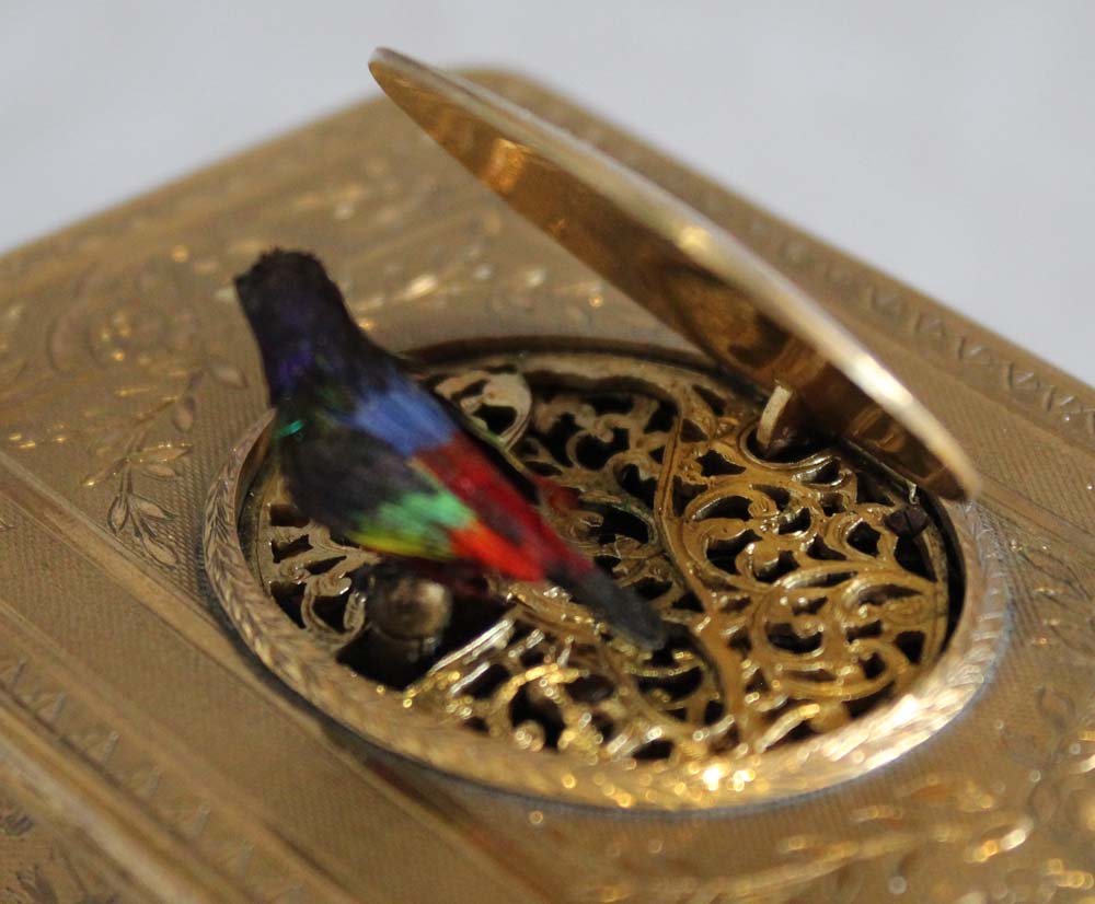 Singing bird box all over engraved gilt bronze case OMM movement.