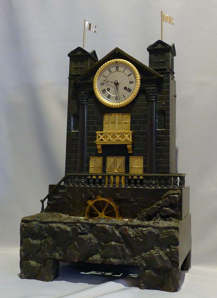 Antique French automaton striking mantel clock with moving water and waterwheel.