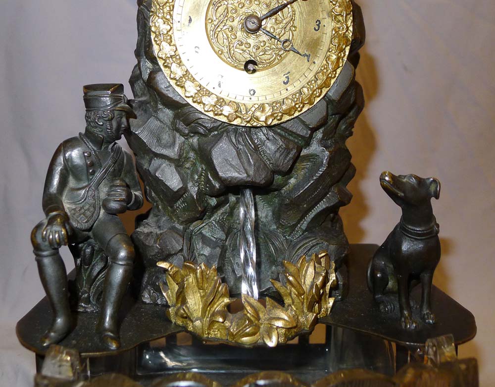 Antique automaton bronze mantel clock with moving water mechanism and hunting scene.