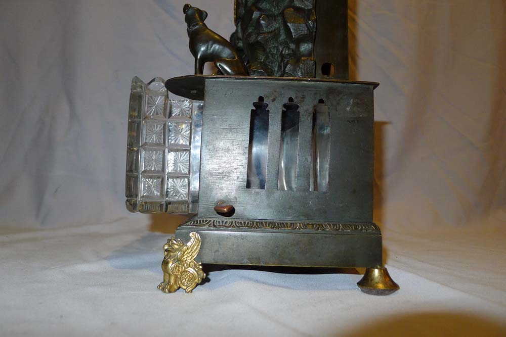 Antique automaton bronze mantel clock with moving water mechanism and hunting scene.