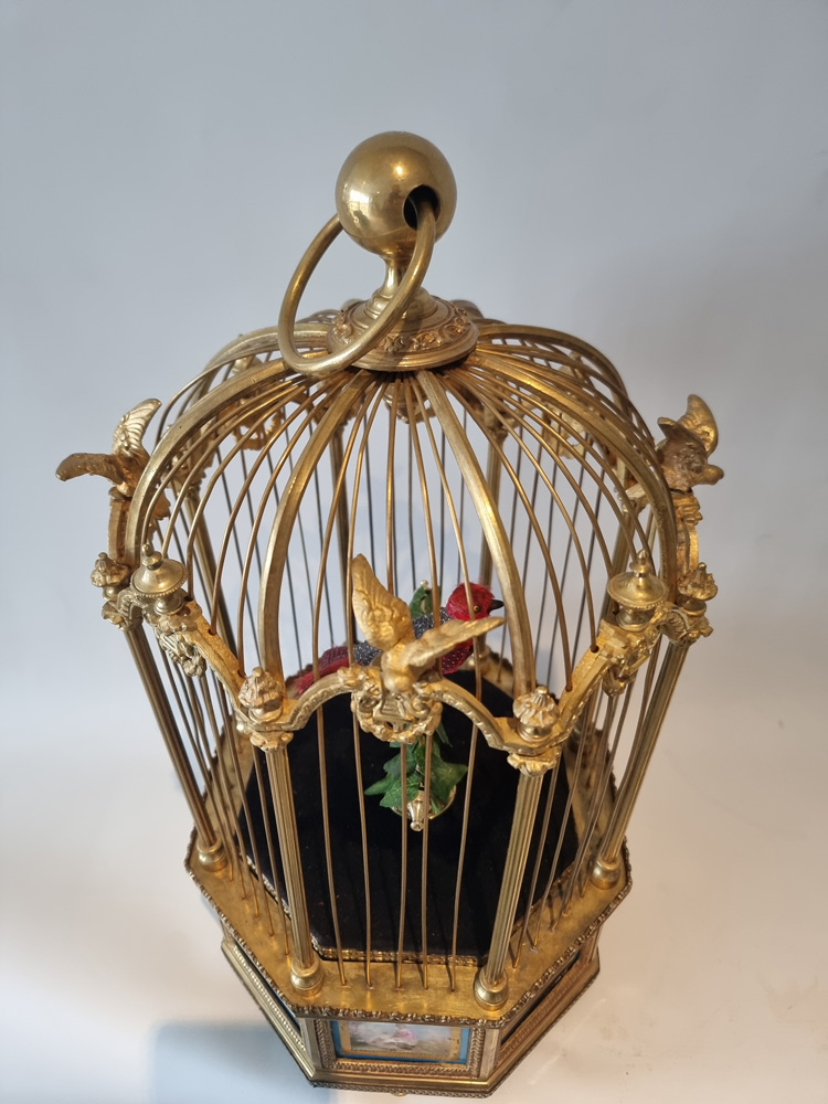 A Stunning Hexagonal Sevres Plague Singing bird Cage by Bontems