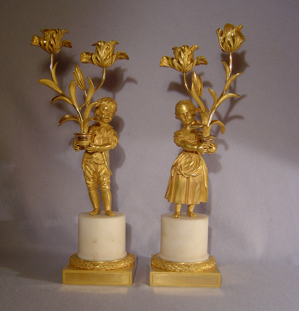 Pair Louis XVIth transitional ormolu and white marble figural candelabra