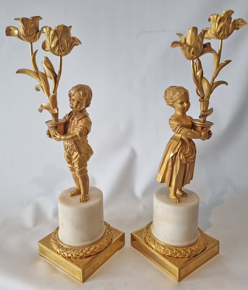 Pair Louis XVIth transitional ormolu and white marble figural candelabra