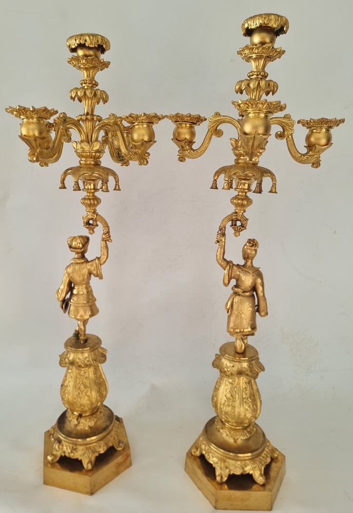 Pair antique French ormolu candelabra held by oriental figures.