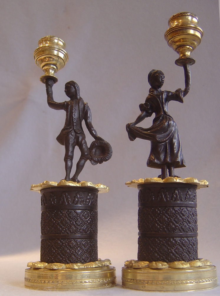 Pair of English Regency figural candlesticks.
