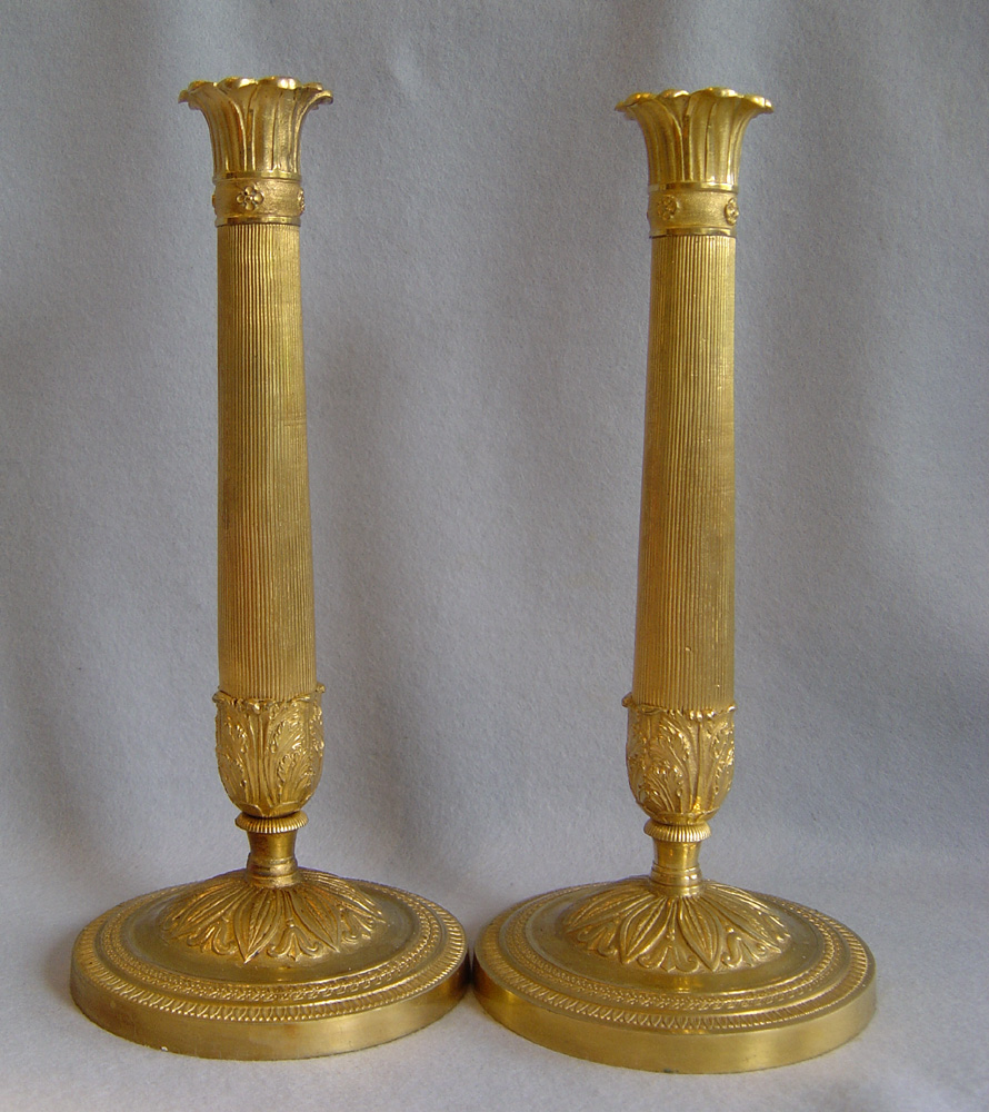 Antique French pair of ormolu candlesticks.