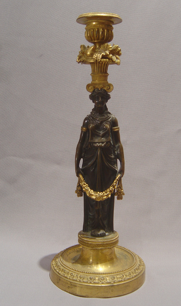 Antique candlesticks French Empire in ormolu and patinated bronze.