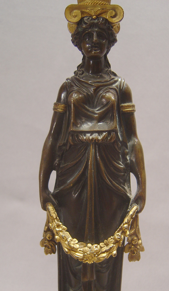 Antique candlesticks French Empire in ormolu and patinated bronze.