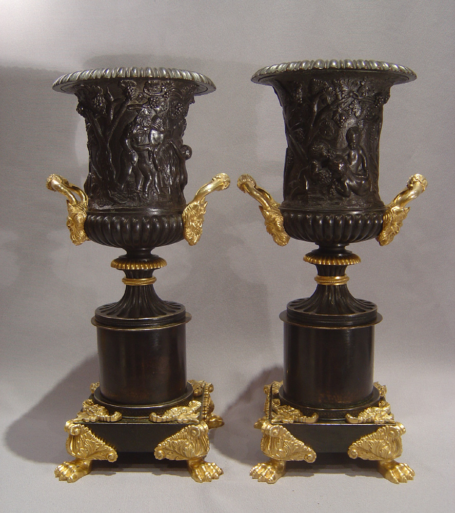 English Regency patinated bronze parcel gilt and ormolu urns.