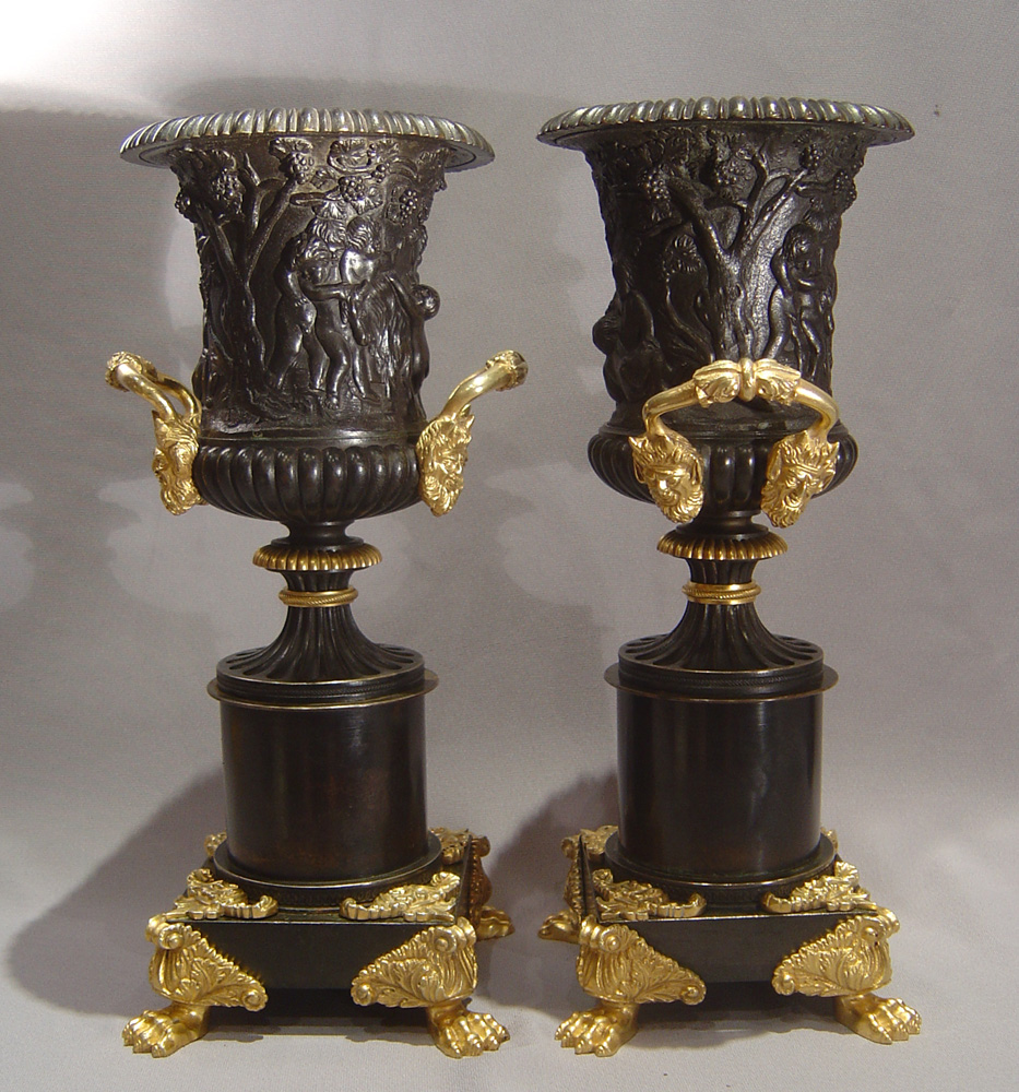 English Regency patinated bronze parcel gilt and ormolu urns.