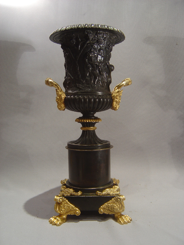 English Regency patinated bronze parcel gilt and ormolu urns.