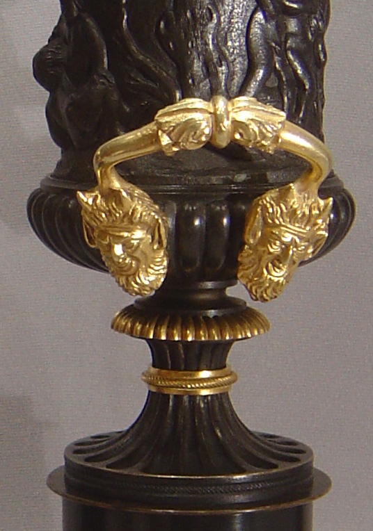 English Regency patinated bronze parcel gilt and ormolu urns.