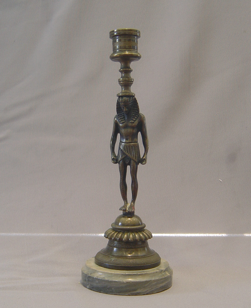 English Regency bronze candlestick in the goute d'Egypt.