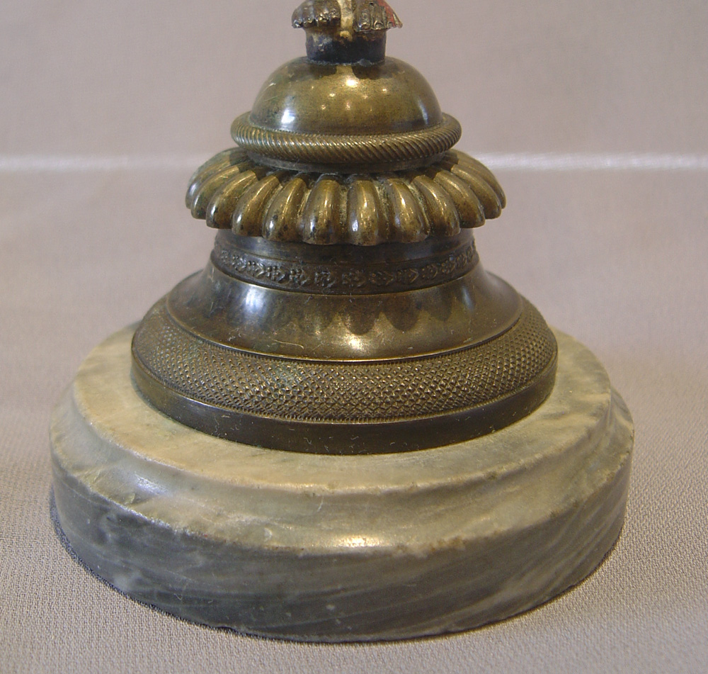 English Regency bronze candlestick in the goute d'Egypt.