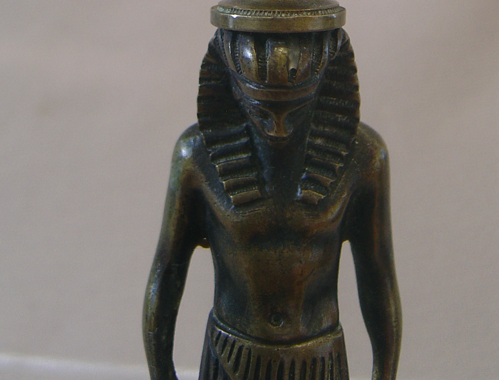 English Regency bronze candlestick in the goute d'Egypt.
