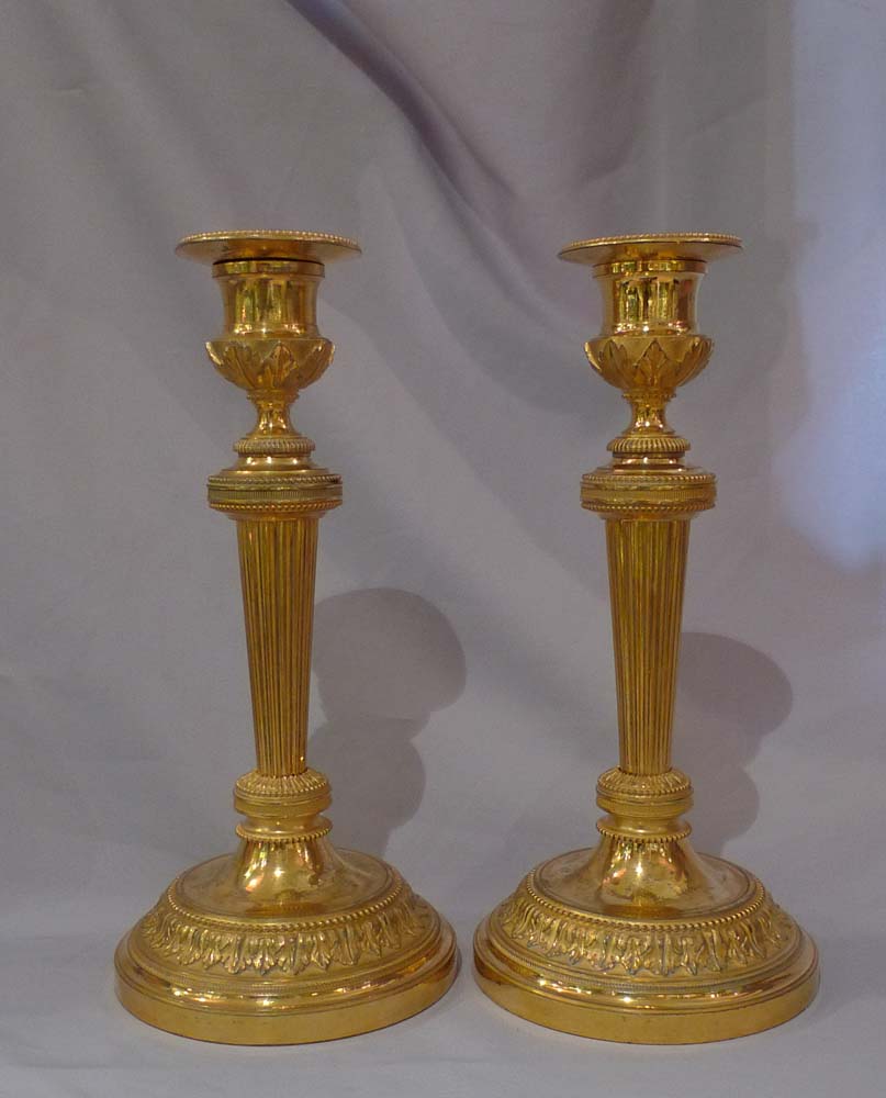 Antique French Empire ormolu candlesticks.