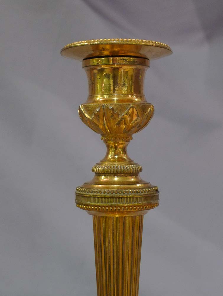 Antique French Empire ormolu candlesticks.