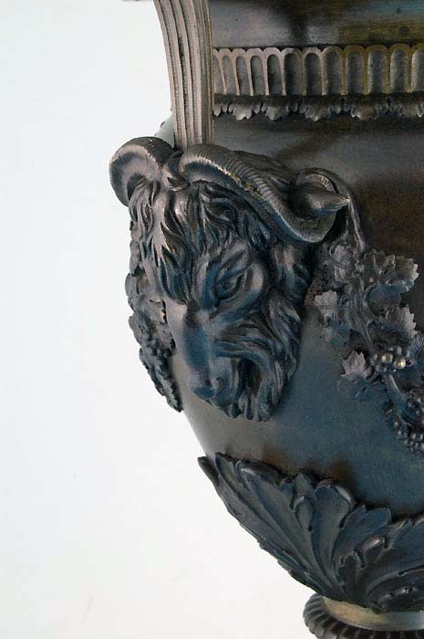 Large antique bronze lidded urn.