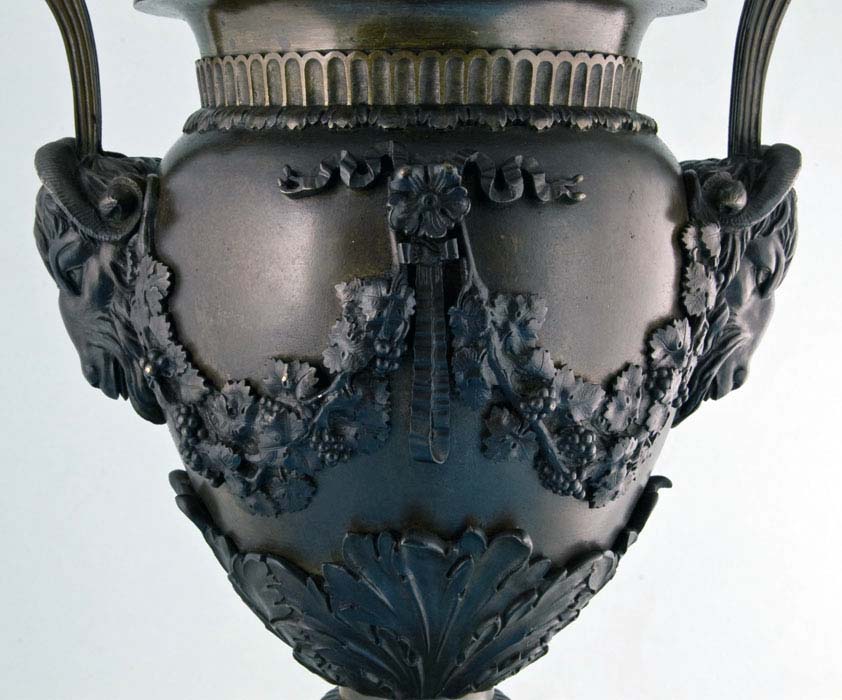 Large antique bronze lidded urn.