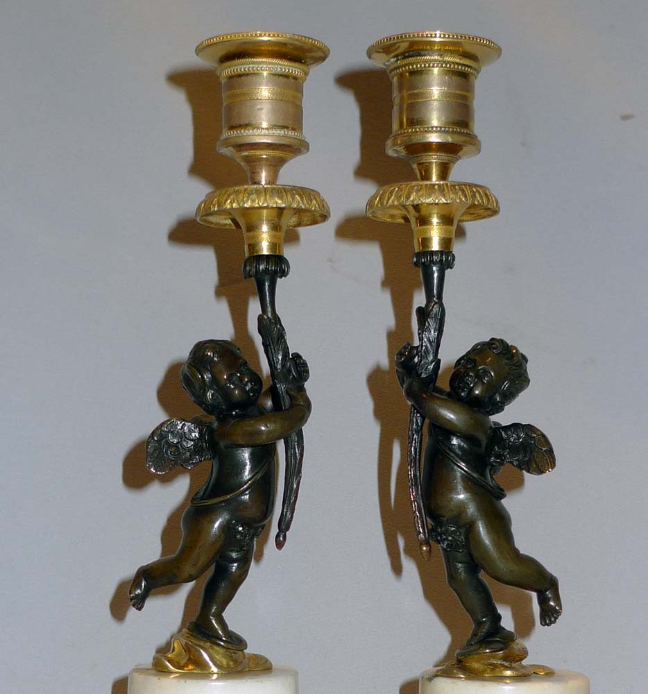 Pair English Regency figural candlesticks in carrera marble, ormolu and patinated bronze.
